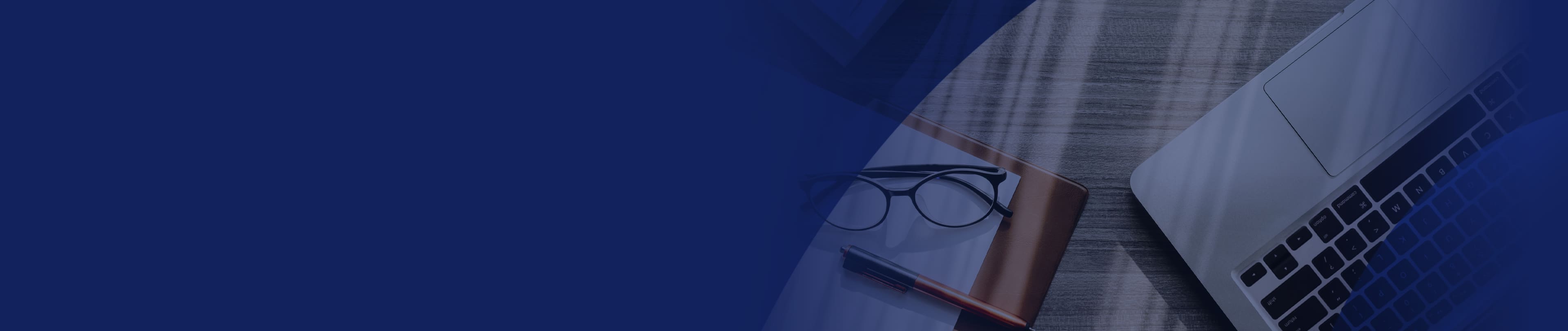 Laptop, glasses and pen